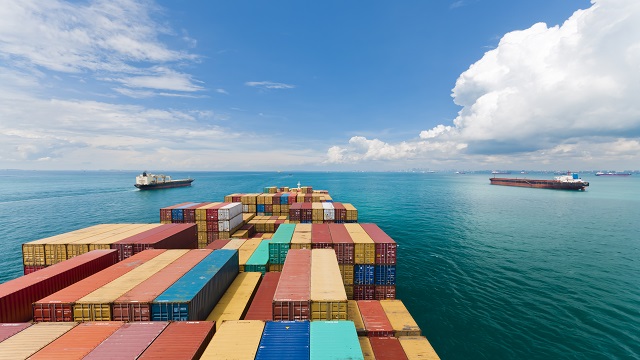 shipping containers on ship on ocean